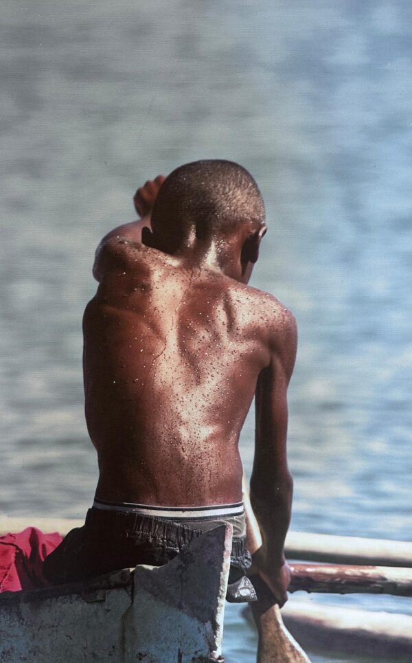 Small boy Rowing boat